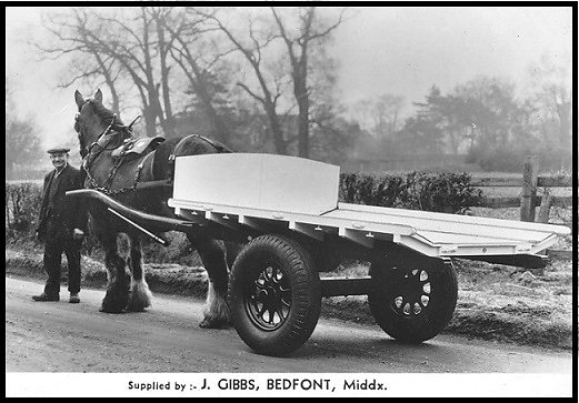 A flat cart built by Gibbs.  The floor sloped inwards to keep produce boxes secure.